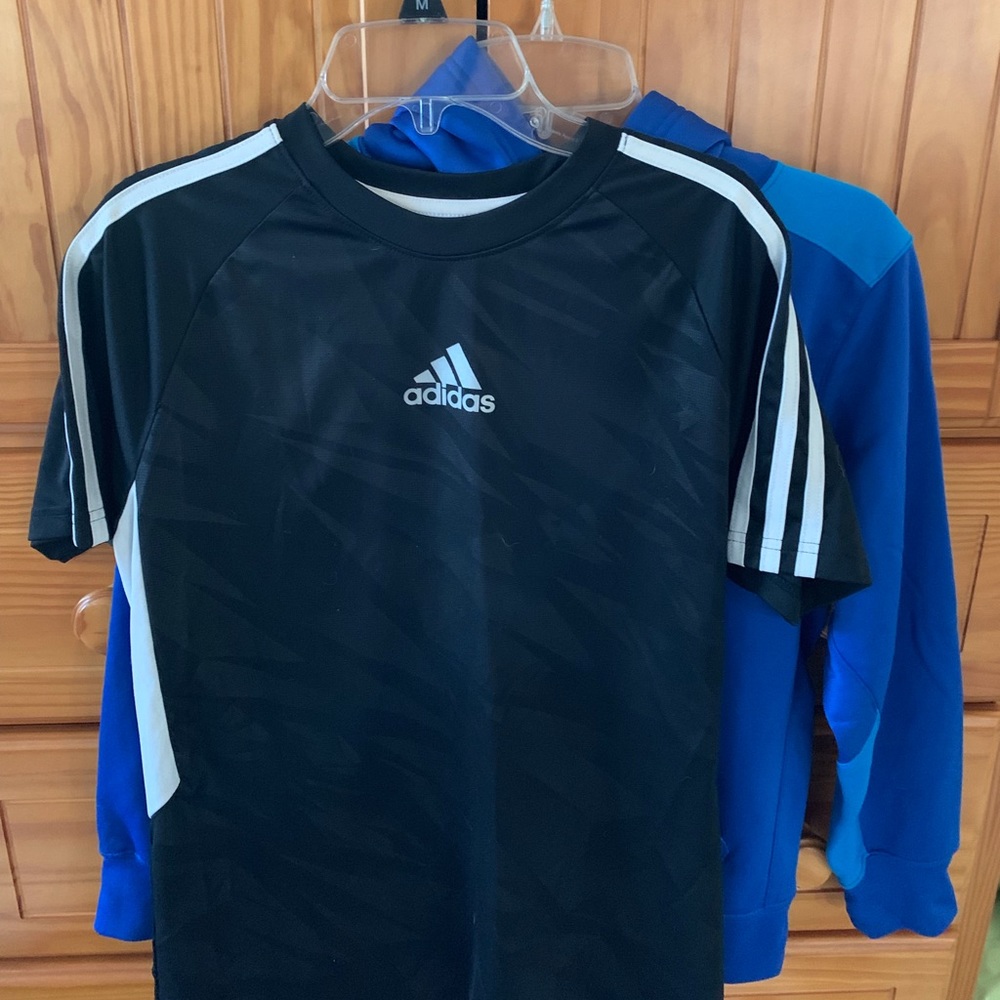 Two athletic shirts. Boys size Large.
